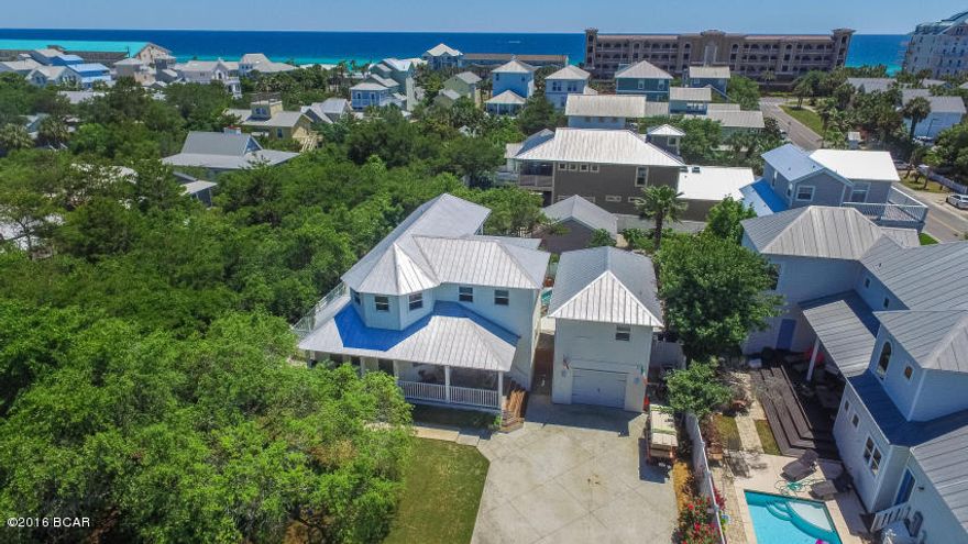 JUST REDUCED $4,000! Brand New Hardwoods in all 1st Floor Rooms!! Beautifully located property, off of Hwy 98, & situated close to Gulf and Beach access. Updated in 2011, the home has great curb appeal with white picket fences, mature landscaping, beautiful Live Oaks and spacious covered sitting porch. Private backyard features an oversized pool deck, in-ground Gunite pool, outdoor shower, sitting areas & summer entertaining bar. Kitchen features Granite counter tops, hardwood cabinets, under-cabinet lighting & stainless steel appliances. Master Suite features balcony overlooking pool deck, large en-suite with bath tub, over-sized separate shower, dual sink vanity & upgraded tile. Carriage house built in 2010 with pine floors, kitchenette, separate A/C, balcony and updated bathroom.