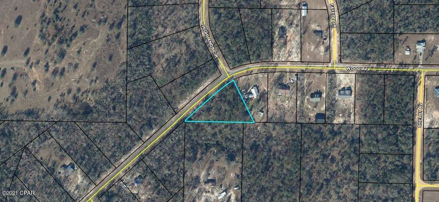 This is a large 1 acre wooded lot on a paved road in the Compass Lake subdivision. Compass Lake is an all-sports lake, offering water skiing, tubing, jet skiing, pontooning, power boating, sailing, wakeboarding, canoeing, kayaking and swimming. In keeping with its reputation as a boating lake, a restaurant along the shore is accessible by boat. Most of the shoreline provides a natural sand beach. Located about half-way between Panama City, FL and Dothan, AL, Compass Lake is only 10 miles from Marianna and Interstate 10. The area is rich in historical significance, with many restored antebellum plantation homes open for tours or as bed-and-breakfasts. Nearby Alford holds a grocery store and some basic services, while Marianna contains nearly everything a resident would need. About 30 miles south, Panama City Beach offers public Gulf beaches and marinas for 'big water' boating plus big-city amenities and attractions. The entire area around Compass Lake is filled with unique geological treasures, some of which are state parks. Two well-known attractions near Chipley, Falling Waters State Park and Caverns State Park, both display in spectacular fashion the effect of eons of water flowing across the ancient limestone.