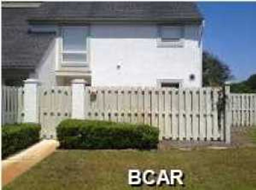 Bay Point Golf Villa over looking the eighteenth fairway. Split bedroom unit with new carpet, fire place, breakfast bar, and deck over looking the golf course. Bay point is a gated community with two golf courses, a marina, and restaurants.