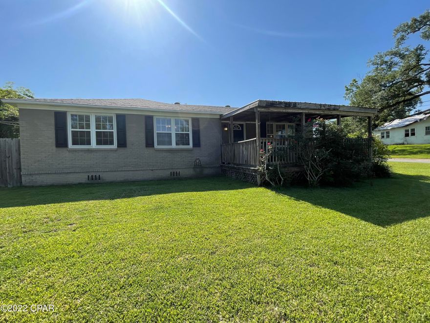 Turnkey 3 bedroom, 2 bathroom brick home on a quiet street in the heart of downtown Marianna. This home features an open floor plan with living and dining room. The master bedroom has been updated to have en suite bathroom and sitting area. It is spacious and unique with plenty of storage. The back door leads you to the mud room/laundry room. The back yard is fenced in with privacy fence. There is a breezy front deck with swings that is the perfect place to enjoy your morning coffee. The home within walking distance of downtown Marianna and is in close proximity to Jackson Hospital, Chipola College, Marianna High School and Marianna K-8.