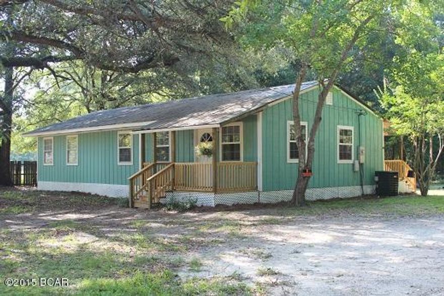 This completely remodeled home is move in ready!  Everything has been redone such as sanded floors, freshly painted inside and out, new a/c, new water heater, new tile, new carpet, new windows, new kitchen, new bathrooms, new fixtures and hardware, new front and rear porches.  This home is like a brand new home.  The home sits on a large .62 of an acre yard.  So you will have plenty of space for kids, pets, boat or RV.  The property has nice mature oak trees and offers plenty of shade.