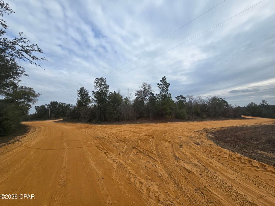 Peace and quiet can be found at 000 Pembroke St.  This multi acre parcel (Lots 5,6,7) can be your blank canvas for the house of your dreams, or a simpler vacation getaway filled with camping and Lake Life.  Compass Lake in the Hills offers many ameneties (https://compasslake.org/), which can be enjoyed if you join the VOLUNTARY HOA ($135 annually).  In return, you gain access to two gorgeous lakes, discounted cabin rentals, pavilion use, tennis and pickleball courts, swimming pool, frisbee golf, driving range, fishing, and a boat launch ramp with RV facilities nearby.  Drive around the area and let me know if this could be the lot you've been looking for.  Located a short drive from Panama City and the Beach, TAF Base, and our ever expanding International Airport.  Close to I-10, Alabama, Georgia, and so much more.