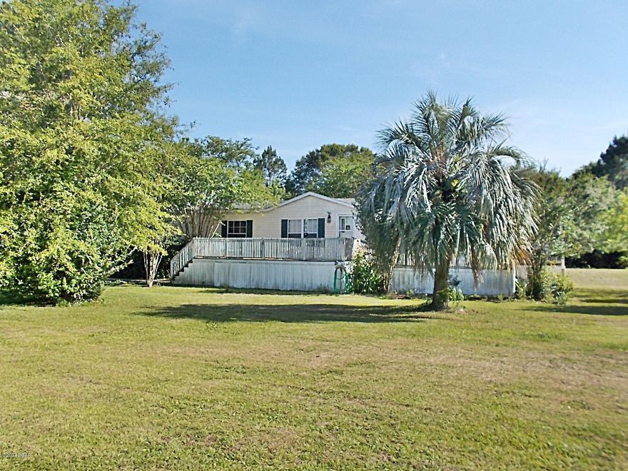 Nice home in quiet neighborhood, this home has a lot of open space a very large living room and a nice size dining room, large master bedroom and large master bath,with a garden tub, part of the yard is chain link fencing, 15x36 double carport and a 20x24 pole barn, lots of nice flowers and shade trees in the yard,the a/c unit and the roof was installed appx 4 years ago. There is a 12x20 covered screened in porch that would be ideal for afternoon quiet time. Please take time to check this home out.It is just minutes from downtown.