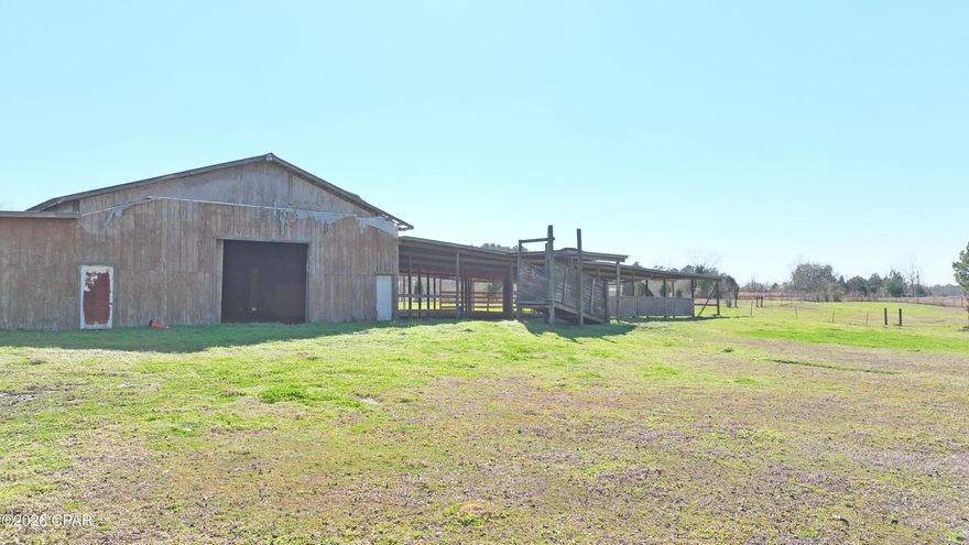 Welcome to 7.74 acres of prime real estate in Bonifay. Conveniently located on HWY 79. This property is ideal for anyone looking to have a farm with their cows, chickens, horses, dogs and whatever other wildlife you have. There is a modular home on the property that is an excellent fixer upper opportunity. An enclosed and open pole barn makes it perfect for animals or if to turn into an event venue for weddings or gatherings. This property has endless possibilities. There is also a 1/2-acre pond to enjoy not currently filled but can easily be filled. Fully fenced property with gorgeous pecan trees. This prime real estate is perfect for family living farming or anyone seeking the country life but still within the city reach.