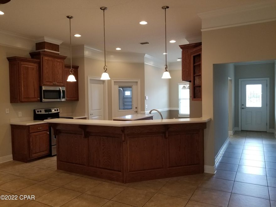 OPEN TODAY 1-4pm! Bring your offer & take a tour of this 3-bedroom 2- bath all brick home that offers front porch, Master bath with Separate shower and jetted tub. Nice master bedroom with rope lighting & extra-large walk-in closet. The kitchen is a dream with all real wood cabinets, island, solid surface countertops, pantry and stainless-steel appliances. Living room has an electric fireplace, crown molding. Brand new Florida room with lots of windows that lead to the outside patio with hot & cold outdoor shower. There are cabinets in the laundry room and lots of closet storage. Home comes with a security system and generator ready electrical outlet. The garage has a man cave for all your tools and stuff.