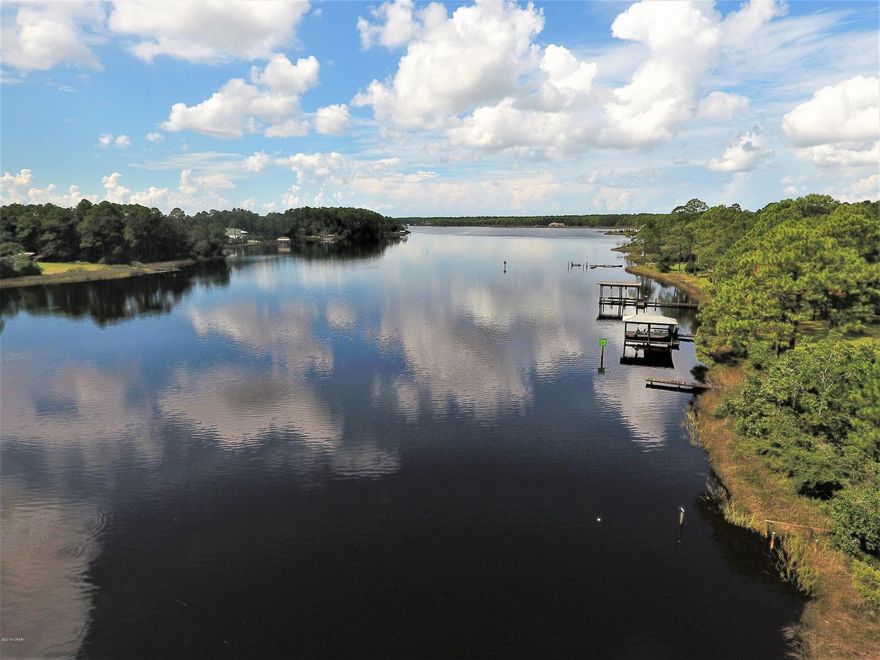 Gorgeous lot on Cooks Bayou with deep water access and a short boat ride to The Gulf of Mexico. Lots of new development in this area, invest in a waterfront lot to build your dream home in quiet atmosphere.   Great location with Cooks Bayou Marina within a short distance from property which offers 12 boat slips, fuel, RV pads with full hook up, restaurant and bar. Bring offer today, will not last long!