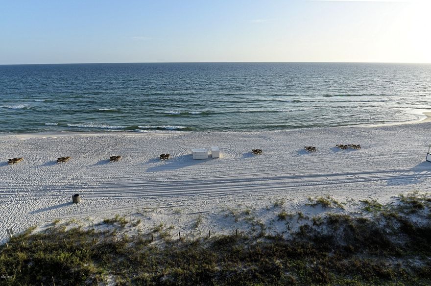 Highly sought after 2-Bed Deluxe. Large glass-front plan with nothing between you and beach! Thoughtful upgrades include tile flooring, plantation shutters, raised ceiling. All the updates you would expect in the full kitchen and bathrooms. Master has beautiful walk-in tile shower. Covered balcony offers gorgeous beach view and breathtaking sunsets. Tasteful coastal decor, fully furnished and Rental Ready! Exclusive Amenities, Lagoon Pool, Hot Tubs, Bar, Restaurant, Pizza Shop, Market. Golf Course, Tennis, Pickleball, Shuffleboard, Fitness Center, Salon Services. Kids Club, Activities, Splash Pad. Owner's pets welcome! Gated entrances. RV, Boat, Trailer, Electric Car parking. Walkable to dining, shopping, entertainment.