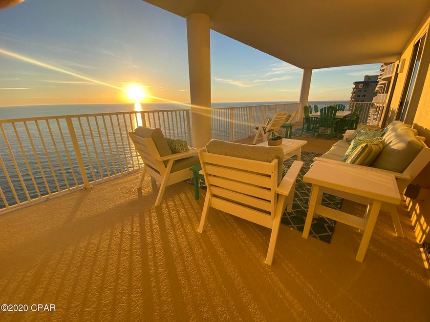 Sweeping East & West views of the Gulf from this very spacious condo with oversized balcony (493 sq ft!!). Highly desirable west end unit!!! This unit is upgraded and GORGEOUS with large, neutral tile throughout for easy and enduring maintenance, newer AC (can't stop a Trane) and newer quality furnishings that are neutral in color. The unit features bullnose corners, tray ceilings, crown molding, kitchen equipped with beautiful granite counter tops, decorative backsplash, and stainless appliances. All rooms are well furnished and equipped to sleep up to 10+ people! Every bedroom has its own private bathroom. There is also an electric fireplace to create a cozy ambience during some of those chilly nights during winter months. There is a stackable washer/dryer that conveys with the unit and an owners closet with private access inside.The balcony is very well furnished with new composite Poly wood outdoor furnishings and it is showcased on one of the largest and best balconies on all of Panama City Beach! Admire the shimmering waters, the playful porpoises, the occasional manatees passing by. Gaze down the coastline or deep into the emerald waters-you can see for miles and miles and miles! Overflow parking is located across the street in the large public parking area and is available with the parking lot app (called Passport Parking Google Play or Apple App Store).  So come enjoy the oversized balcony, read your favorite book and sip your favorite drink. Cool off with a dip, your just footsteps to the beautiful emerald waters and powdery sugar white sands of the Gulf of Mexico. This one is equipped to service tenants or owners right down to the linens and dishware, silverware, etc.