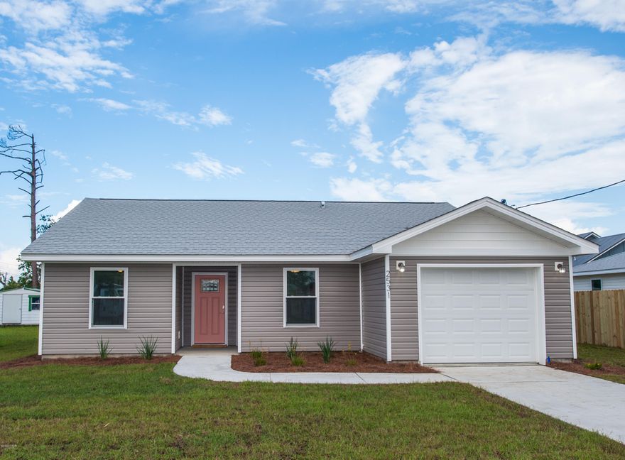 Back on Market due to financing falling through. BRAND NEW CONSTRUCTION! An amazing house at an amazing price! This beautiful, brand spanking new home is on a large 67x100 lot close to Tyndall, Eastern Shipbuilding, and the 23rd Street corridor. A bright and open floorplan makes the house feel big and airy. You will love the large kitchen with granite counters, shaker style soft close cabinets, a hop up bar, and modern stainless steel appliances! The master bedroom has a massive walk in closet, a granite vanity top in the bath, and double barn doors to the bath and closet. Every room has beautiful luxury plank flooring, and all of the lighting is energy efficient LED. There is a wooden deck out back, the lot is fully irrigated and sodded.  Add to all of this a spacious garage with overhead storage and you have the perfect home. Construction is complete, it is move-in ready! Come see it today, it won't last long!