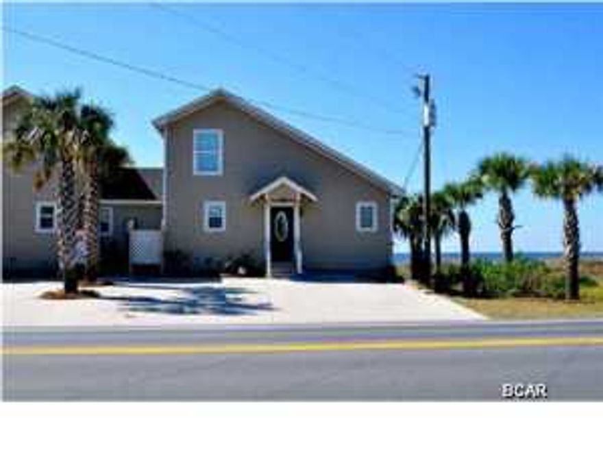 Upscale Gulf Front at St Joe Beach Florida. Impeccable design in this 3BR/3B Furnished home. Entering the front door enjoy views of the Gulf from this beautiful open living atmosphere with vaulted wood ceilings and hard wood flooring. The kitchen has custom wood cabinetry, granite counters and stainless appliances. Also on the main floor is a Gulf Front Bedroom and Full Bath. Beautiful wrought iron and wood staircase leads upstairs to a bedroom with bunk beds, full bath and a Gulf Front Master with Full Bath. The Master also has a private deck offering beautiful views of the beach and sunsets. A large lower deck across the back of home and just off the living room is a great place for entertaining and accessing the beach. This home was totally renovated in 2009, HVAC,
