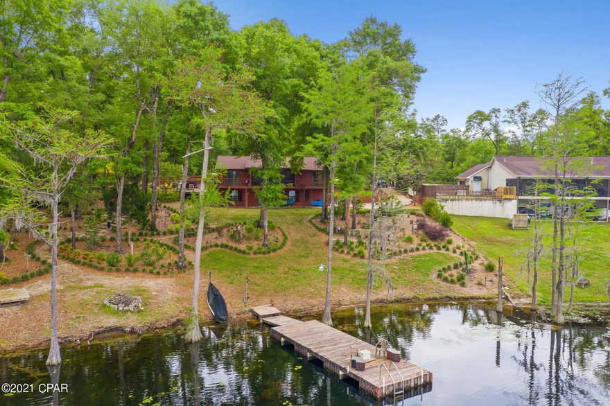 Currently under contract, seller accepting back up offers. Serene lakefront home, nestled on a lushly landscaped double lot with stunning views of Dunford Lake. This property is located in the gated Paradise Lakes Subdivision with underground utilities and community boat ramp. This four bedroom, three bath well maintained home comes furnished and turnkey to start enjoying lake life on day one. All toys and tools are included in the sale to enjoy and maintain this wonderful property. Property features include covered and open porches, patio, two wells, whole house generator, two car drive under garage and boat dock.  A must see property!