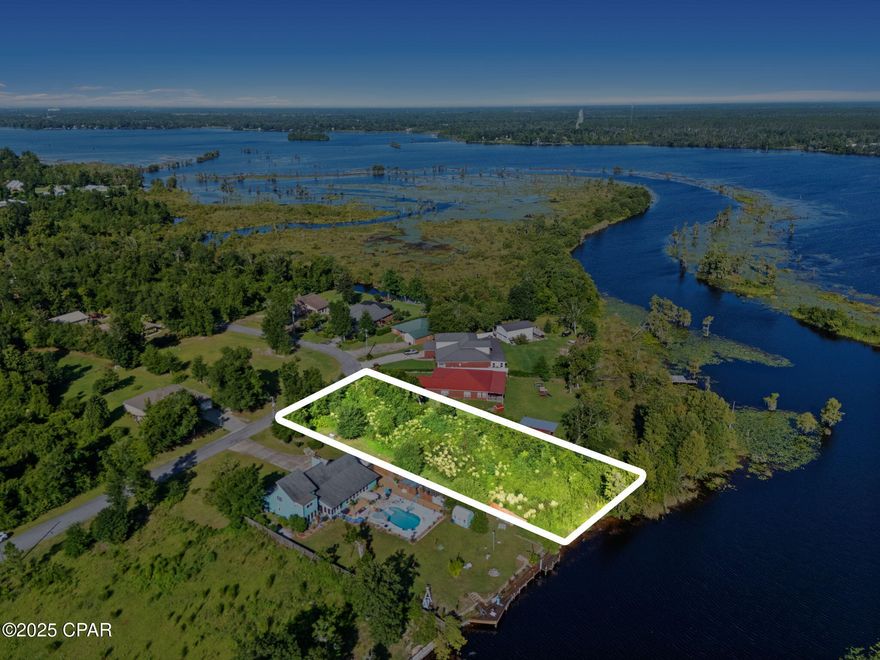 Ready to build your waterfront dream home? Or maybe your private weekend escape? Whatever you desire, this partially cleared, .568 acre lot offers a clean canvas with 100' of direct waterfront access to Deer Point Lake; one of Northwest Florida's most known areas for fishing, kayaking, or simply soaking up nature's beauty. Located in a quiet, private area with no HOA restrictions, this property gives you the freedom to design and build where the only limitation is your imagination.  It's central location makes this a great find being located in a quiet, secluded area, while still being just a short drive to the hustle and bustle of Panama City where dining, shopping, and the sandy beaches are calling your name. Are you ready to unlock the full potential this beautiful lot has to offer?
