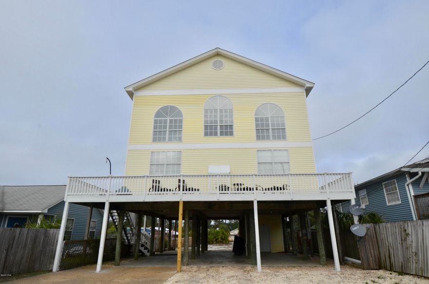 CURRENTLY UNDER CONTRACT, SELLER ACCEPTING BACKUP OFFERS - Stunning renovations in this rare 4 BR home located a block from the beach access at Rick Seltzer park and walking distance to the ever popular Finn's & Mr. Surf's shop. Cathedral ceilings, wrap around balcony, propane fireplace, and the master on the main make this home a top pick for a primary residence OR it is zoned R2 capable of additions to expand with room for a pool to make this an income producing short term rental. With plenty of covered parking, you can bring all your boats, RV's and toys for summer vacations you'll never forget! High end Samsung Family Hub Fridge, new washer / dryer, and all appliances convey. With all new paint throughout, new waterproof vinyl flooring, new toilets, disposal, and a new water h