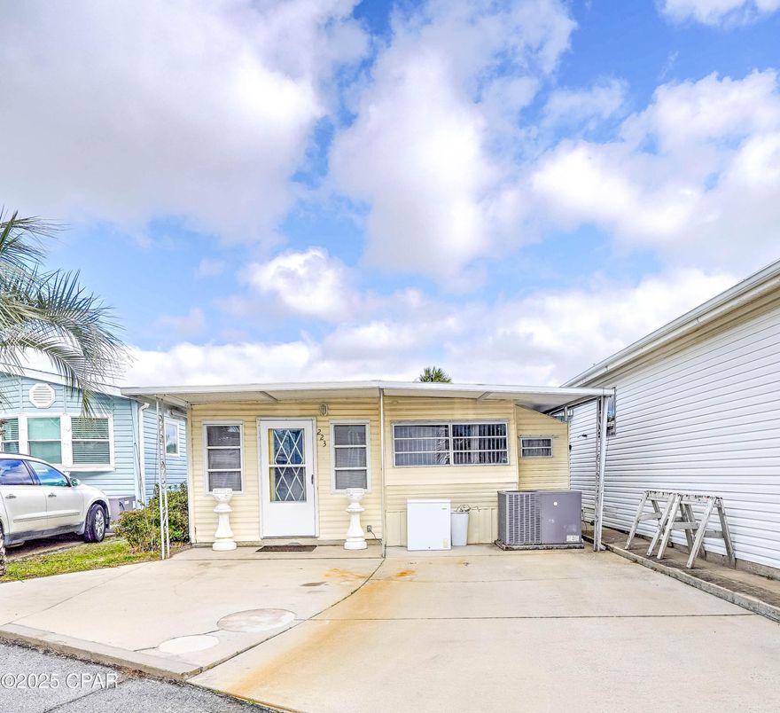 Here's your chance to own in Venture Out! Check out this adorable 2-bedroom charmer. Good size living room and bedrooms. Seller has recently added shiplap in bedroom and bathroom giving the home that modern coastal charm! Perfect opportunity for investment or second home.  Venture Out is a golf cart community that has exploded with popularity recently... With 300' on the beautiful pristine beaches of the Gulf of Mexico and 1,000' on the Grand Lagoon. Venture Out has something for everyone.