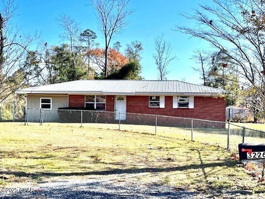 HOME & 2.26 ACS. in Dogwood Heights just north of town.  Home  features a large living room, 3 bedrooms snd 2 baths.  There is a bonus room with exterior and interior access.   A small sun room overlooks the back yard.  The property has chain link fencing and a newer metal roof.  The location is ideal for the family with children as it is near the new Marianna High School and the new Marianna K-8- school.  Also Sunland, Marianna Industrial Park and the Marianna Airport is just a few minues away.  With some repairs and updaes yu will have a lovely home to enjoy for years.