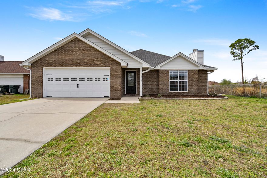 **CURRENTLY UNDER CONTRACT, SELLER WILL CONSIDER BACKUP OFFERS** ALL BRAND NEW windows!! This stunning brick home is situated on an oversized fenced in lot in the heart of a highly sought after family friendly neighborhood with no HOA! This home features, a kitchen with some brand new appliances, granite counter tops, and ample cabinet storage. In the open living space you will find inverted hip ceilings, recessed lighting, a wood burning fireplace and plenty of natural light. In addition to three spacious bedrooms, there is a fourth room that can be used an office space, den, play room, or another bedroom! Both bathrooms have been fully remodeled. While a privacy fence surrounding the oversized back yard, a chain link fence closes in the preservation land that is included with the house. This land can not have any permanent fixtures built on it, but it is perfect for pets, children, gardening, and reassurance no one will move in next door, delivering that secluded feeling while still being near everything the City of Lynn Haven has to offer! Home is situated on a cul-de-sac and has a two car garage so plenty of parking for any entertaining or boat/RV storage. Reach out to your favorite Realtor if you have any questions on how we can make this your HOME!!