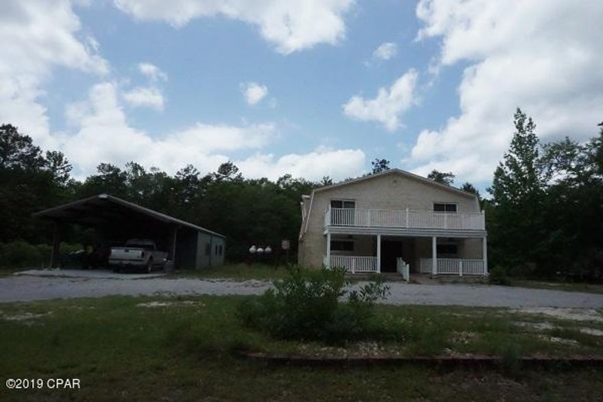 Move in ready home close to the beach.  This 2 story all brick home has  2 bedrooms, a bath, large family room with a fireplace, screen porch and the laundry room on the down stairs.  Then you go upstairs  to a roomy kitchen, dining area, living room with another fireplace, master bedroom and bathroom along with a 1/2 bath for guest, another screen porch and a deck off of master bedroom.  The man of the house is going to love this 1440 sq ft metal workshop with a bathroom and office along with carport for more storage. Home has been well maintained and is ready for you so better hurry on this one.