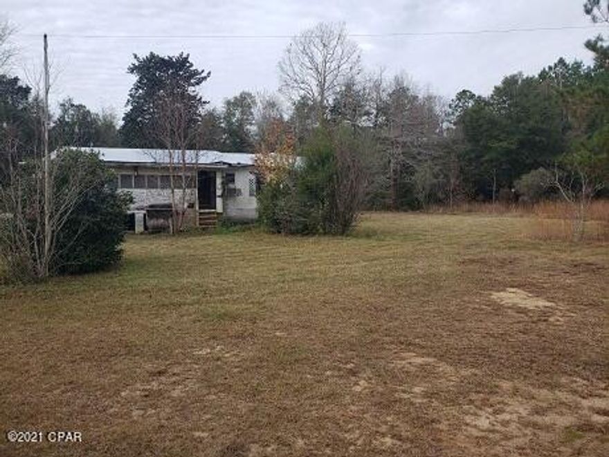 2BR/2BA Home on large 2.6 acre lot.  Close to shopping, dining and schools.  Home in need of repair.  All Dimensions are Approx.