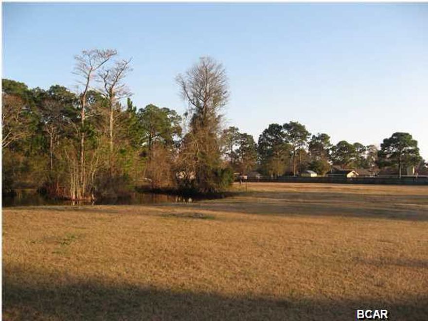 SECLUDED ESTATE, NEARLY 3 ACRES WITH FISH STOCKED POND, AND ONLY TWO MILES FROM BEACH. Rare opportunity to live in a peaceful country setting while living the Florida lifestyle....and just 2 miles from the emerald beaches and 1 mile from the Navy Base! Land is zoned for horses and livestock but can also be used for a small business (see deed restrictions).

Also one main home and one (possibly two) smaller homes can be built on this large spread of land.