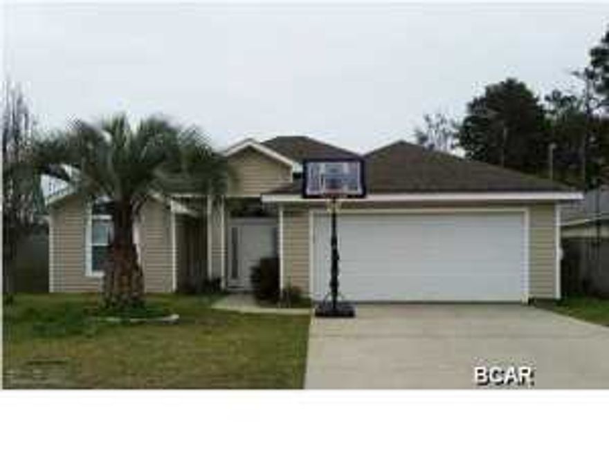 This charming 3brm/2bth home features a very roomy, open floor plan with a breakfast bar & large walkin pantry.  The split bedroom plan is perfect for family privacy. Spacious Master has large walkin closet, dual vanity sinks, and garden tub. Covered patio overlooks back yard and shed, enclosed by a privacy fence. Excellent opportunity for investment property!!! Currently rented monthly for $1300, till the end of June.  Walk to Lake Powell, the Beach, or drop your boat in at the public access and do some fishing!  Less than 5 minutes to 30A, or shopping at Pier Park.  Be it your primary residence, vacation home, or investment property...you can't go wrong with this low maintenance​​‌​​​​‌​‌​​​​‌​​‌​​​​‌‌ treasure