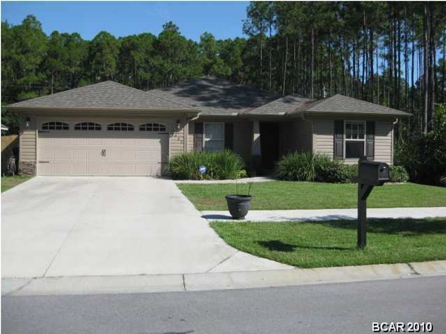 CRAFTSMAN STYLE home in one of Lynn Haven's newest subdivisions, THE PINES. This wonderful home offers a stacked stone entryway, 4 bedrooms 2 baths, very spacious and open floor plan, wood cabinets, stainless appliances, granite countertops, tile, walk in closets, separate laundry room and much mores. You will just love spending time outside in the back yard with the new privacy fence and extensive landscaping which has recently been completed, and to maintain the yard there is a sprinkler system. Underground utilities and sidewalks. sizes, ages, including sq. ft. are approx. measure if important. Click on the photo for additional pictures of this great home. Seller is offering a $1,500.00 carpet allowance with an acceptable offer.