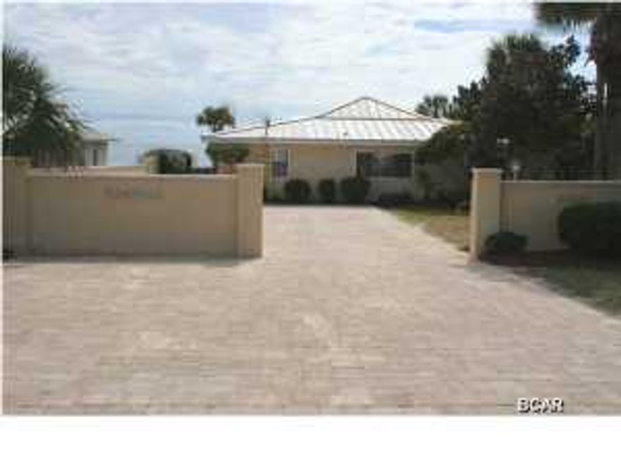 Best of OLD and New! Welcome to Paradise! 50' of gulf front that is 29' above sea level.  Retro Florida living at its best.  All one level. Grass area on street side, beautifully landscaped.  Stucco walls around and fencing. Could easily add a gate for extended privacy. Lots of parking areas.  Build your own pool beachfront or street side.. Old time beach living newly remodeled. Nothing to do to the house, but enjoy! Travertine Tile Floors spacious living areas. Granite, tile and onyx countertops in kitchen and bathrooms.Driveway and outside back huge Patio is all Pavers with a fire pit.



Inside a bar for 4 people by kitchen, dining area beachfront.  This homes master and 1 other bedroom is beachfront.  4 bedrooms 3 baths.



This home is being sold furnished