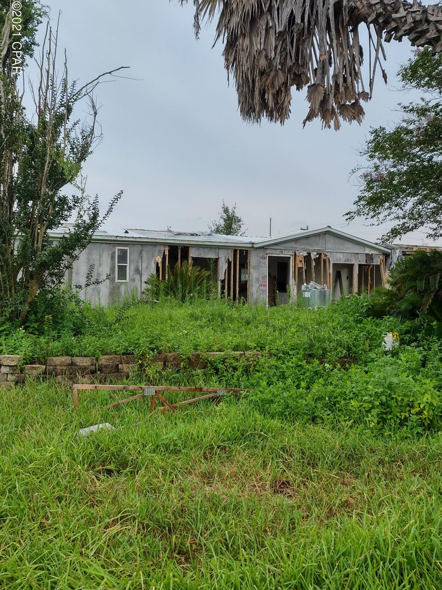 7410 Bay Crest Road, just under an acre in much sought after Southport Florida. The property currently has a mobile home on the lot that is not livable and will need to be removed Property is located on a paved Road with a corner lot. It has great potential to build your dream home. Property sold as is, COUNTY IS DEMOING. CALLING ALL INVESTORS. Value is on the lot....LOCATION! LOCATION! LOCATION!