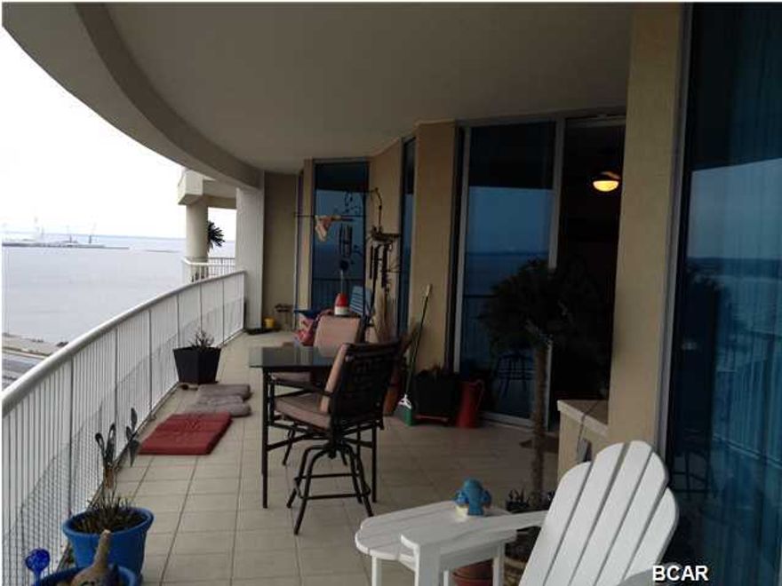 Marina Landing condo over looking St. Andrew's Bay with a great view of the Bridge. This is a two bedroom, two bath split bedroom unit with a large living room/kitchen with sliding glass doors leading to an over sized balcony with built-in grill.