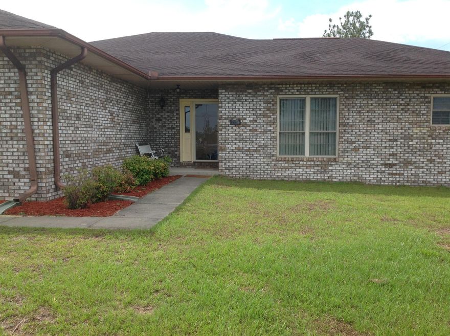 Private Country setting this 3/2 charming Brick home in Sunny Hills offers the best of all worlds: Privacy with plenty of space and only 39 miles to the beautiful Sugar Sand Beach of Panama City. The Sunny Hills community offers so many desirable amenities such as an 18 hole Gold Course, Tennis  Swimming & lakes for Fishing. Like new appliances, Stainless Steel side by side Refrigerator, Range & Dishwasher, Microwave. French Doors in Living Room and Dinning Room lead out to large covered Florida Room that overlooks a huge fenced backyard. Home is on two lots on the corner of Yale & Concord. This is an absolute Must See!.