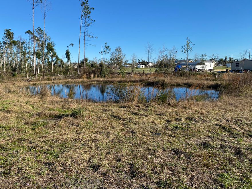 Take a drive for yourself and see this fabulous building lot in a peaceful location at the end of the road so not much traffic or noise, yet close to town.  Property features a nice pond, electric and water already there,
