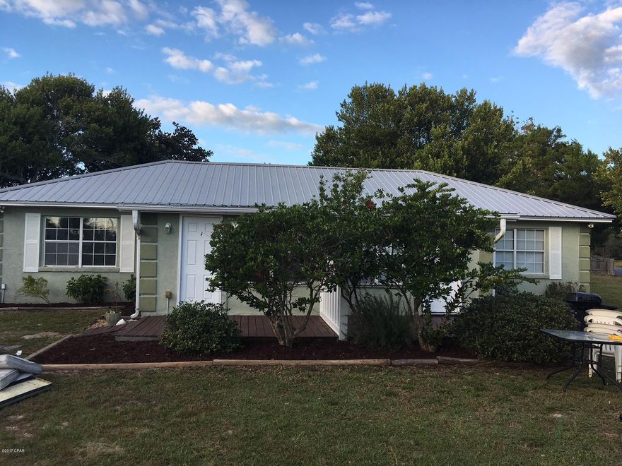 WALK TO BEACH FROM THIS CORNER LOT DUPLEX. LARGE LOT WITH QUICK ACCESS TO BOTH MIDDLE BEACH (HUTCHION BLVD) AND BACK BEACH (PCB PARKWAY). CLOSE TO THE BEACH, PIER PARK, RESTAURANTS, ETC. (all measurements are approximate buyer should verify if important)