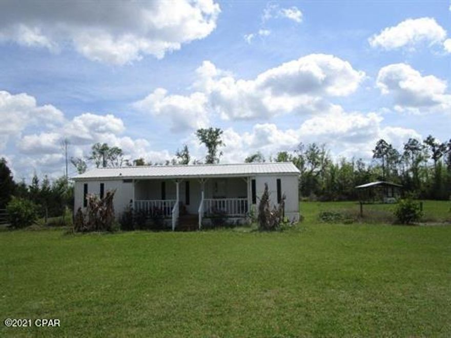 Affordable country home on over one and a half acres. This 2 bedroom 2 bath home could be easily converted back into 3 bedrooms! There's plenty of covered space for your boats and utility vehicles with the large 3 bay pole barn and covered back deck area. There is also a huge storage shed under the pole barn. 30 minutes to Marianna, and only 1 hour to either the beaches or Tallahassee puts you close enough to go have fun but far enough away to avoid all the craziness and have a little peace and quiet. 



There is some exterior work that needs to be done and the sellers are willing to replace the siding with a full price offer or adjust the price if you would prefer to do it on your own. All offers welcome.