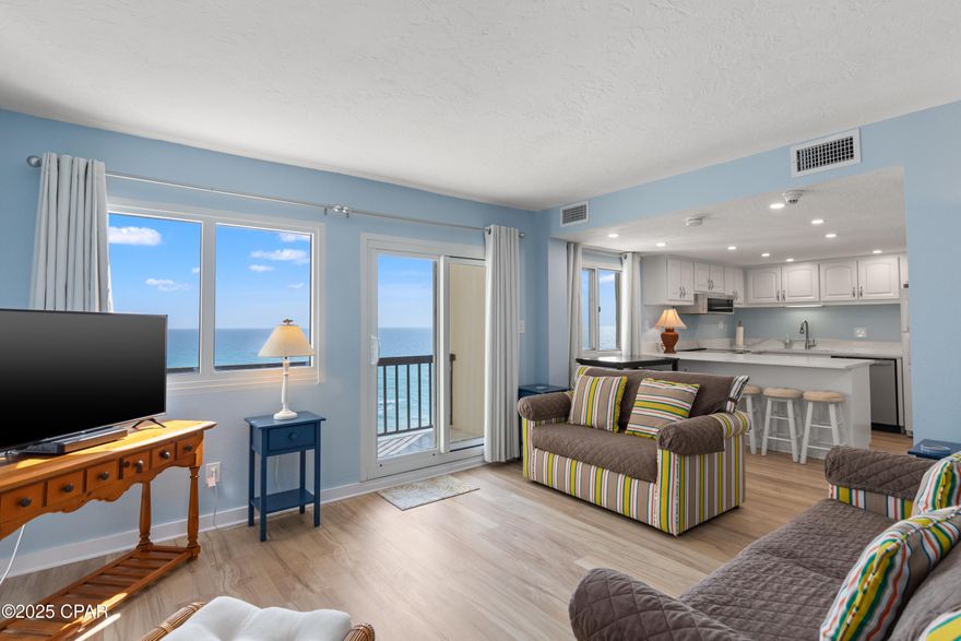 This beautifully remodeled gulf front condo offers the perfect blend of modern luxury and coastal charm. From the moment you step inside, you are greeted by an open-concept living area featuring windows that frame breathtaking views of the Gulf of Mexico and the Tower's indoor/outdoor heated pool.
The kitchen has been updated with appliances, solid-surface countertops, and cabinetry, making it both stylish and functional for cooking and entertaining.  The half-bath laundry features a large stack washer/dryer.  The bathrooms showcase modern fixtures, beautiful tilework, providing a spa-like retreat after a day at the beach.
Luxury vinyl plank flooring runs seamlessly throughout the condo, complementing the crisp, neutral color palette. The master suite boasts direct access to a private balcony overlooking Lake Powell, perfect for enjoying morning coffee or watching the sun go down for the day. 
With direct beach access just steps away, this remodeled gulf front condo is an exceptional opportunity to experience waterfront living at its finest.
Pinnacle Port Resort is situated on a 25+ acre site within a beautiful gated community having over ¼ mile of beach frontage!  The complex has lots of amenities including two swimming pools, tennis courts sauna/steam room, fitness room, its own private freshwater dock with boat slips boat launch and wi-fi.   Please note that the Association fees include electricity for heating, cooling and hot water.  The owner pays a small electricity bill for lighting and appliances only.