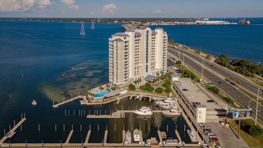 Sold Furnished with storage unit. UPGRADED! BAY FRONT, Beautiful 2BR/2BA Condo in Prestigious Marina Landing overlooking St Andrew's Bay. VIRTUAL TOUR. Both bedrooms are direct water front for the ultimate sunrise views, watching the yachts & sail boats go out to sea , jet skiers, and water activities.  Boat slips available to purchase or rent. This is a boater's dream! This unit is located on the quiet west end of the complex away from the elevators.  All updated cabinets in the kitchen with stainless hardware, stainless appliances, granite counter tops and glass backsplash.  Matching glass backsplash on fireplace wall.  Both bathrooms have updated cabinets, granite countertops, sq sinks and rain forest showers.  Custom Window Coverings, custom closets, new window Coverings, custom closets, new ceiling fans, closets, new ceiling fans. Fireplace & grill replaced. Living Area, dining & Kitchen have bamboo hard wood flooring. Tastefully painted in a light grey.  Don't miss your opportunity to purchase this UPDATED BEAUTIFUL CONDO TODAY!!!  Extra large balcony (48 x 13) has a grill and phenomenal Bay Views!  Some furniture shown in photos & virtual tour will be replaced with different furniture.
