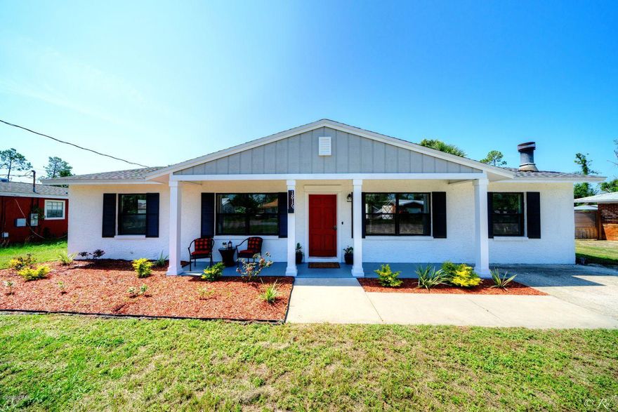 Centrally located and beautifully updated 3 bed, 2 bath home with a large backyard. This home is welcoming with a covered front porch adorned with columns. The open living room, dining area, and kitchen floor plan offers a wide open space for hosting friends and spending time with the family. The den features a wood burning, brick fireplace and a closet with shelving for extra storage. The kitchen is equipped with a plethora of beautiful cabinets, plenty of counter space, new stainless appliances, a pantry, and a breakfast bar. There are double doors off the kitchen leading to the back patio, allowing for seamless hosting. The spacious master bedroom is equipped with a private en suite and has a great view of the backyard. The guest bedrooms share a full bathroom with a shower/tub combo. The bedrooms allow for plenty of natural lighting through the windows to illuminate the rooms. There is also a coat closet for extra indoor storage. This home has many updates including a new roof, HVAC, flooring, and more. The large, fenced backyard features a patio, fire pit, a yard building, and palm trees. The opportunities to create a backyard oasis are endless. This home is just a short drive to the Hathaway bridge, making trips to the beach and Pier Park a breeze! Located near schools, parks, shopping, restaurants, and more.