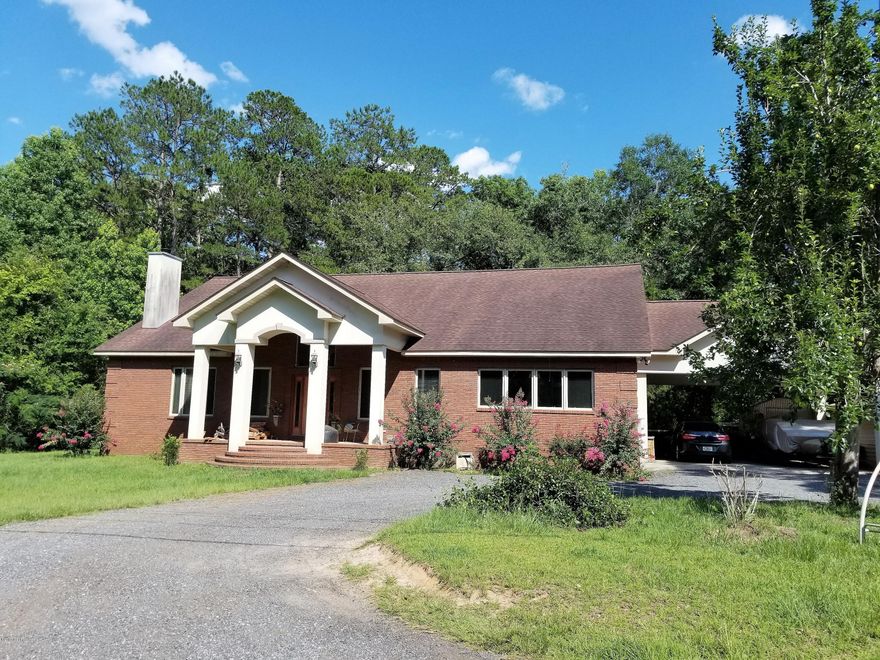 Designed for family living on 2.29 ac. 4004 sq ft. total, 2600 Sq ft on 1st floor, with 19 ft Vaulted ceiling, Open concept floor plan, Beautiful stone fireplace, Nice kitchen with double wall ovens, 4 br and 2 1/2 baths, large laundry/mud room, 1/2 bath is (Fema) approved storm shelter. There is 1400 sq ft upstairs, (sheet rocked but needs trim work) with 18 × 20 children's den and two 17 × 18 bedrooms, each with a 12 × 12 closet and 1 bathroom with a corner

shower. 2 central heat & A/C units with avg FPU bill $200 mo.