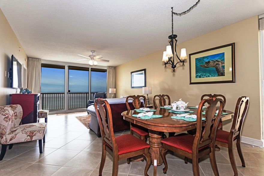 CURRENTLY UNDER CONTRACT, SELLER ACCEPTING BACKUP OFFERS:  GORGEOUS 3 BEDROOM WEST FACING CORNER UNIT + TWO PRIVATE BALCONIES!  This ideally located 8th floor condo has 1,532 sq. ft. and features upgrades throughout, including elegant new porcelain tile in all rooms, tiled backsplash and kitchen bar, granite countertops, stainless appliances, built-in wine cooler, jacuzzi garden tub, and only 3-year old HVAC and hot water heater. Breathtaking panoramic views of the Gulf abound from almost every room. The extra-large balcony is perfect for large families to enjoy magical sunsets together and one guest bedroom also has its own private balcony for enjoying that early morning cup of coffee. 

Majestic is the Most Amenity Rich resort on the beach! It has 4 pools (2 indoor heated), 2 hot tubs, baby pool, wading pool with waterfall, H20 Bar and Grill serving poolside lunch and dinner, state of the art fitness center with steam room and sauna, 130 seat movie theater, convention center, private owner's lounge with full kitchen, tennis courts, Majestic Market featuring Starbucks coffee. And, it is a short drive to the shopping, dining, and entertainment at Pier Park. Plus, the massive multi-year street renovation project is almost complete and looks fantastic!  NOTE: All dimensions are approximate and should be verified by buyer if important.