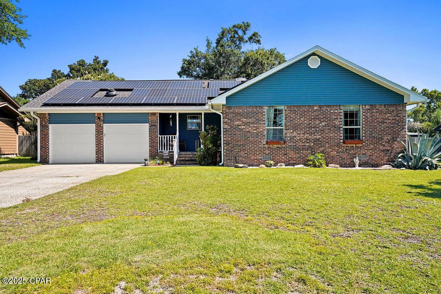 Welcome to this charming all-brick 4-bedroom, 2-bath home offering both comfort and affordability, located just 14 minutes from Tyndall Air Force Base and a short 26-minute drive to the white sands of Mexico Beach. Set on a beautifully landscaped lot, this home boasts mature trees and a fully privacy-fenced backyard, complete with a sprinkler system on a separate well—perfect for maintaining lush greenery while keeping utility costs low. Speaking of savings, the home features paid-for solar panels to help you avoid high electric bills, along with a brand new A/C unit, a 3-year-old water heater, and a new well pump for added peace of mind.

Inside, you'll find a spacious living area centered around a stunning wood-burning Ben Franklin fireplace, perfect for cozy evenings. The layout includes a bright breakfast area and a generous sunroom currently used as a formal dining space—ideal for hosting family gatherings or entertaining guests. The oversized master bedroom features a walk-in closet and a private ensuite bath with a walk-in shower. All bedrooms are well-sized, and the versatile 20x14 bonus room upstairs serves as a fourth bedroom, home office, playroom, or media space. A two-car garage and a shed offer ample storage for tools, lawn equipment, and more.

If you're searching for affordable living with practical upgrades and a convenient location, this is the home for you. Schedule your private tour today!