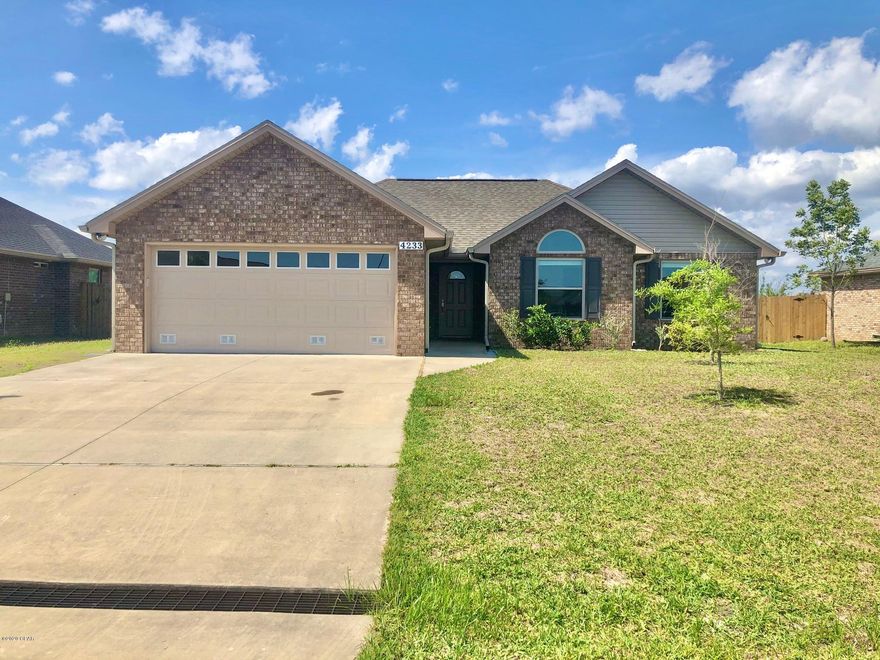 MOVE IN READY, 3 bed/ 2 bath, all brick home in Bylsma Manor Estates. NO HOA!This custom built home is well maintained with a new roof, new wood floors, fresh paint, & is ready for it's new owner! It has raised tray ceilings, all wood cabinets in kitchen & laundry room, solid surface counter tops, & a seating area in the master bedroom. The home comes with security system & generator ready electrical outlet in the garage. Large fenced back yard with an enclosed screen porch, outside shower, & sprinkler system. 

All info/sizes/measurements are approximate. Buyer to verify if important. Close to great schools, shopping, Tyndall Air Force Base, and not far from the world's most beautiful beaches!