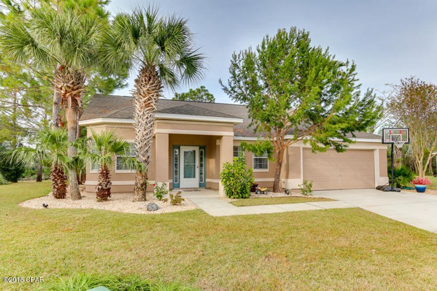 This immaculate professionally-designed home with a 2 car garage boasts over 1,800 sq ft of heated and cooled space. With 3 bedrooms, 2 full size baths, generous living space and stylish finishes you will enjoy the perfect setting for relaxing and entertaining. Highlights include, a brand new hot water heater, AC unit (inside and out), and new heat pump all installed Feb 2018. All toilets and faucets are new, new paint throughout the home, an oversized Florida room, storage shed and 2 community pools. This desirable golf cart friendly community is conveniently located to the best entertainment, schools and restaurants Panama City Beach has to offer. Take your golf cart or ride a bicycle to the beautiful white sandy beaches, Pier Park or Frank Brown Park. The spacious kitchen with a breakfast nook features plenty of cabinet space, a large pantry, stainless steel appliances, a breakfast bar and tiled floors.  

Enjoy gatherings in your large great room with vaulted ceilings with plenty of space for relaxing with family or friends. The large master bathroom with a private access to the Florida room features a his and hers walk in closets, a double vanity and a tiled shower. The 2 additional bedrooms have tons of comfortable space and storage. This home is located on a cul-de-sac and backs up to a wooded area allowing you to enjoy your privacy.  Porcelain tile was recently purchased for the Main areas of the home, including bathrooms. You don't want to miss your opportunity to own this beautiful home!