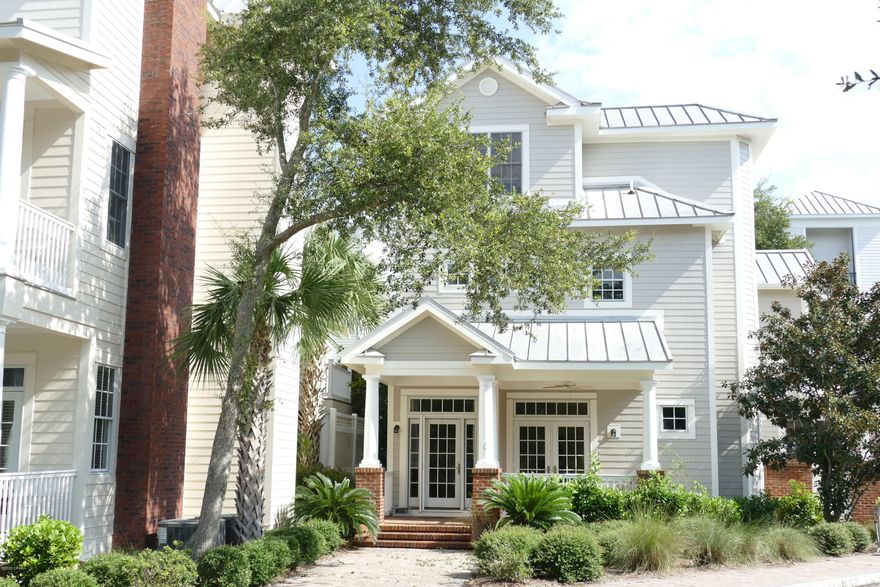 Take a look at the only true detached residence with a private courtyard and one car attached garage in Waterhaven! Boasting a deep covered front porch and a paver walkway to the front door. Enter the first floor into the beautiful living room. The first floor hosts dining room with complete wet bar, a half bath, ice maker and wine cooler. The private courtyard is off the dinning area, making a wonderful private spot for dining or a morning cup of coffee. The unit boasts  hardwood flooring throughout, high ceilings, paneled interior doors and crown molding throughout.

The Pella double pane windows and doors give security and ample natural light.  The Chef's kitchen features  Pro grade appliances and including a six burner gas stove and sub zero refrigerator.  Granite counter tops are found throughout the home. The second floor hosts the Master bedroom featuring two walk in closets and the master bath has double vanity, large garden tub, and Separate shower and water closet. The second floor also hosts a guest bedroom with two closets and En Suite as well. In the second floor hallway. You will find two storage closets as well. On the third floor you will find the third bedroom and bathroom. This home has the features of a detached home; yet is classed as a condominium; which has some advantages. This home is ideally situated directly across from the amenity building. You are just steps away from the fitness center & theatre!

The amenities of Waterhaven include:
The longest dock on St. Andrew's Bay available to owners as a day dock.
Boat ramp access
A separate storage lot for boat or trailer 
A gorgeous Bay front pool with restrooms
Community building with community room, kitchen, a theater with group seating, fitness center, a back deck and summer kitchen for entertaining. 
This home is getting a new metal roof and new exterior paint in 2020 fall of 2020! Call today to schedule your private tour.