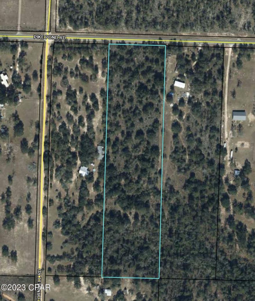 10 acres high and dry with owner stating there is a spring fed creek at the back of the property. Fenced on all sides except the hwy frontage.  Wooded.  Here's you chance to own land without any deed restrictions. Build your dream home or set up a mobile home for country living.  Excellent fishing, boating,swimming, 4 miles down the road at Compass lake.  Dollar General 2 miles, Panama City approx 40 miles away.  Great location. Alford Fl is only 6 miles and Fountain only 7 min.