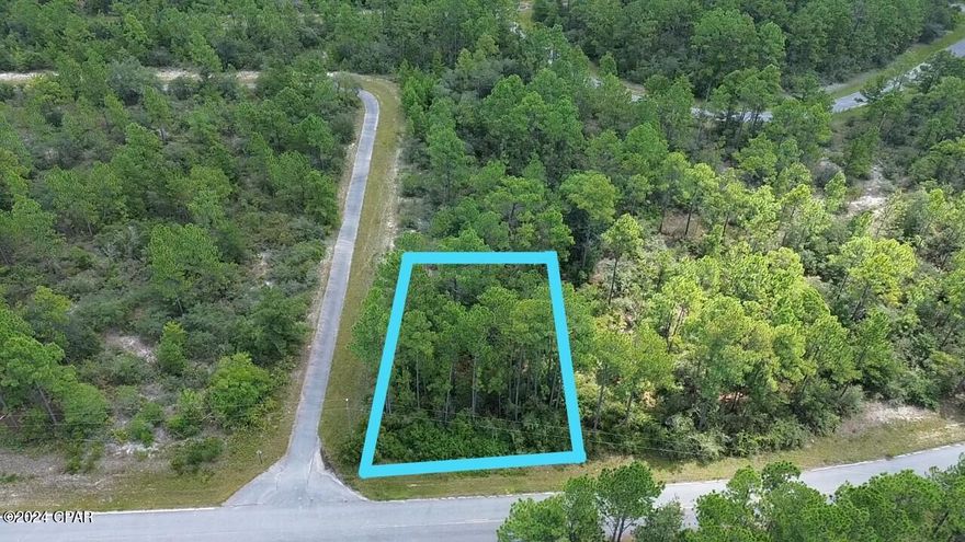 This just over a quarter acre wooded property sits on a corner lot in the Sunny Hills subdivision. Sunny Hills is home to a golf course, Boat Lake Swim Park, a recreational park and numerous other freshwater lakes (see photos). It is accessed by a paved road and is less than an hour from Panama City Beach. This would make a great home site that would give you the country feel with the convenience of the city close by. There is a $36.94 MSBU assessment applied to the taxes annually.