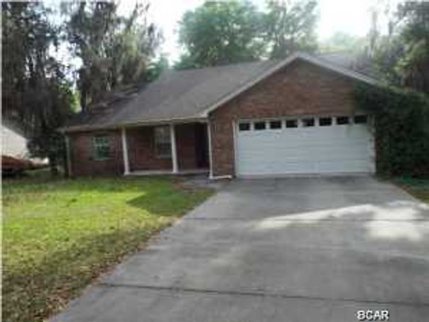 REDUCED!!! Three bedroom two bathroom brick vinyl home in Youngstown backing up to a canal offered as is. The canal leads to Deerpoint lake but is not navigable. All sizes approximate please verify accordingly.