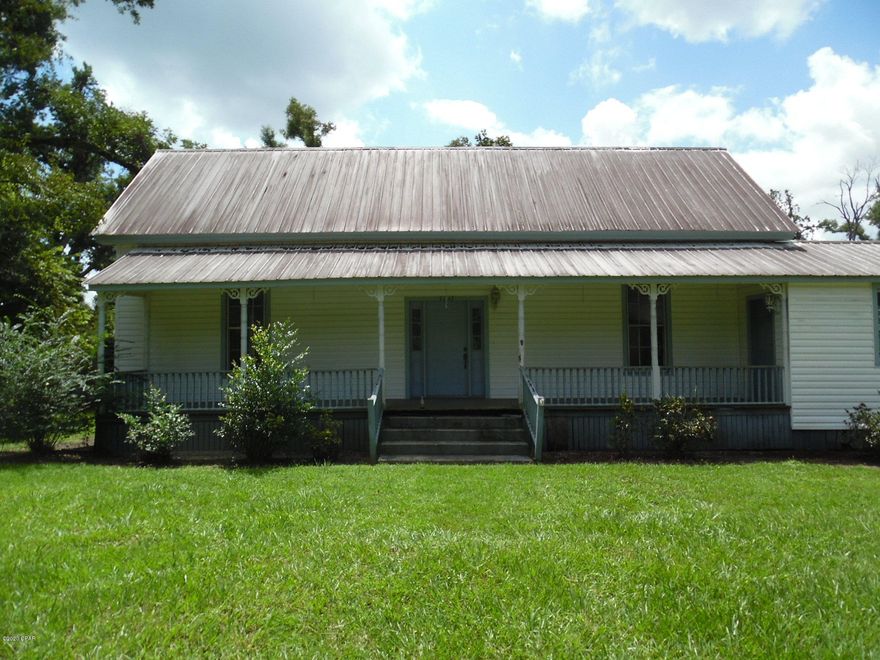 At the risk of sounding trite. This home has amazing potential.  11' ceilings in living room, dining room, and Master bedroom.  Hardwood floors in much of the home. This home could use a little TLC, but WOW, it could be a real show piece . 3 bed room 2 bath home in town limit of Greenwood FL., with outbuilding.  Home has an office/study right off of master bedroom with its on entrance as well.  If you have been looking for a home to make your own that has unsurpassed character do not hesitate!  Call today to schedule your showing of this unbelievable opportunity! This home will NOT qualify for FHA, VA or USDA.  Will require cash, rehabilitation loan,.
