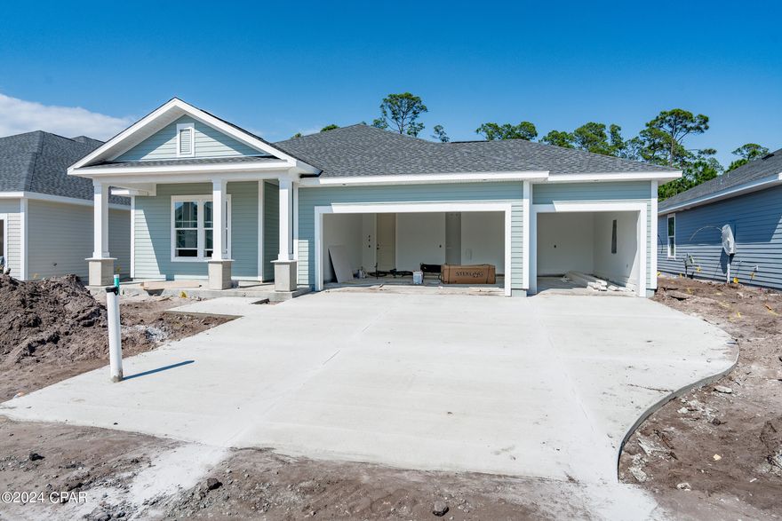 This lovely Sand Dune plan offers a 3-car garage to provide ample space for storage or for keeping additional vehicles like a golf cart. It backs up to conservation land, offering privacy and potential for creating a beautiful outdoor space.

With 3 bedrooms, 2 bathrooms, and a dedicated office, the home offers functionality and flexibility. The open concept design of just over 2000 square feet can make the space feel even more spacious and inviting, ideal for entertaining guests or spending quality time with family.
