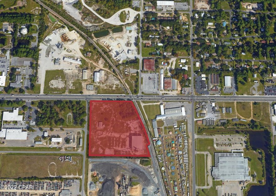 The property is on the South side of 15th Street and is 11.196 acres. The property is zoned Industrial with 600 front feet on 15th Street. There are some derelict structures on the site that will be removed. The Bay County Parcel ID # is 16060-010-000.