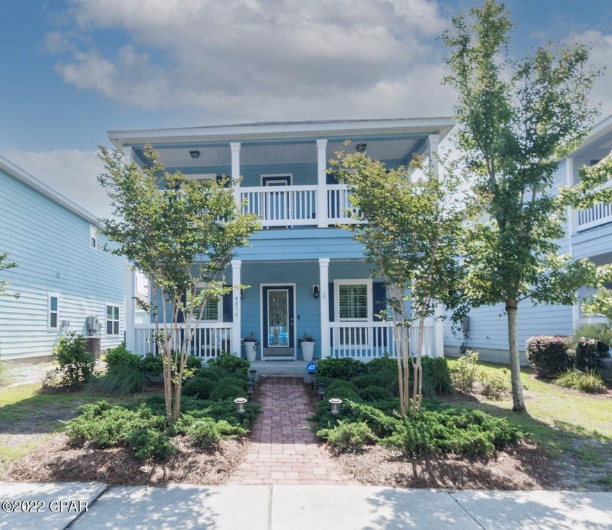 Beautiful Florida Cottage in the lovely bayfront gated community of Magnolia Bay Club! This 3 bedroom, 2.5 bath home is newly painted inside and out and has gorgeous luxury wood flooring. The open concept of the downstairs, makes it perfect for entertaining with the dining room opening up to a large paver courtyard with deck and 2 car garage. The kitchen features granite counters, tons of cabinets,  HUGE pantry and stainless appliances. Upstairs are two bedrooms, laundry, landing area & large master suite w/ walk-in closet and balcony.  Many upgrades!! The community features a heated pool overlooking the bay with pavilion,grill area, dock, kayak storage, community room with pool table and fitness center. Great view of bridge and serenity trail near water with bench to relax in the shade!