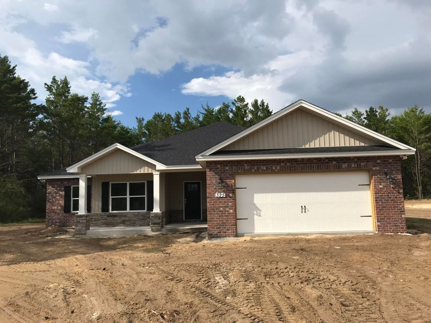 NEW CONSTRUCTION 4/2 ON 1 FULL ACRE LOT-easy access to Panama City & Lynn Haven's main shopping corridor, Tyndall AFB, and the Naval Coastal Systems Base. Interior of home offers upgraded lighting fixtures, super durable laminate wood flooring, large living room and dining room, kitchen with locally built cabinets, solid surface counter tops, large island, unique accent lighting and stainless steel appliances,large Master Suite, convenient linen closet and walk-in master bath closet, recessed lighting and crown moldings. Exterior features large lot, two car garage, partial sodded yard with sprinkler system and covered porch, brick and vinyl. Please verify all measurements and other listing information if important.