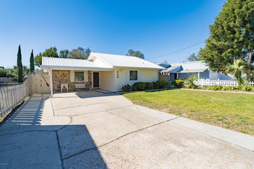 What a doll house! This immaculate home is located in the sought after beach community of 'Open Sands'. This home has wonderful features which include .. an open floor plan of the living /dining and kitchen area, a cozy fireplace in living area, two nice size bedrooms, a nice Florida room, a fenced in back yard with patio, a nice storage shed, an oversized driveway with covered front patio. Just from driving by the home seeing the pristine yard, new windows & siding and metal roof that this home has been well cared for and loved! You can feel the love from the moment you walk in the door! Not only is the home awesome the location is great too! Only a few blocks to the Beach, and only a few minutes to Pier Park & 30 A. This home is truly a delight to view! Come see for yourself.